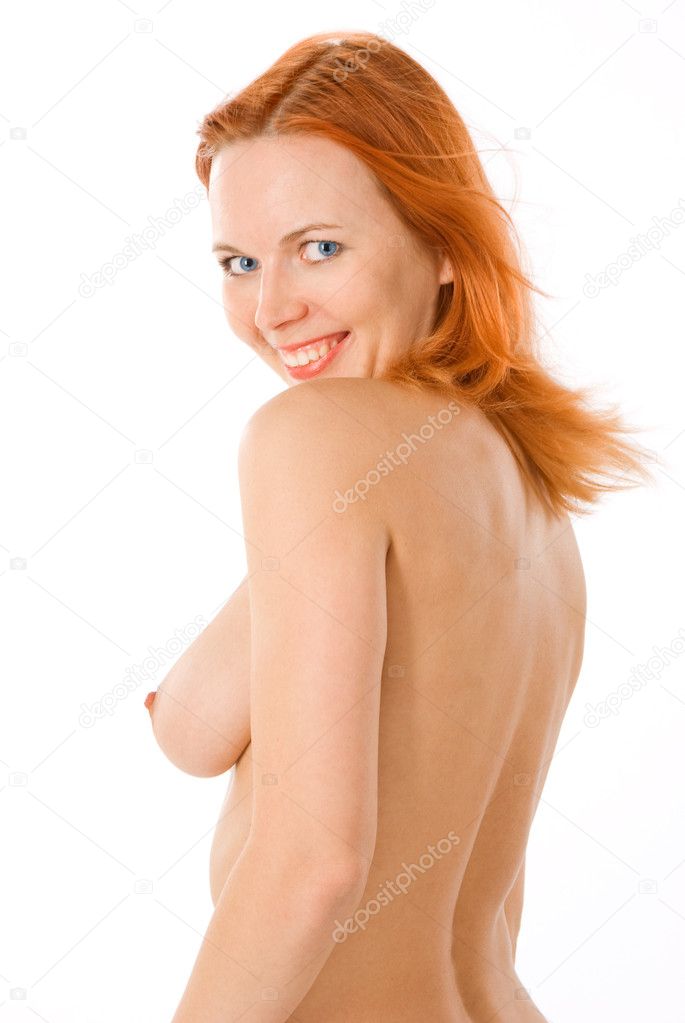 Sexy naked redhead woman in studio on white