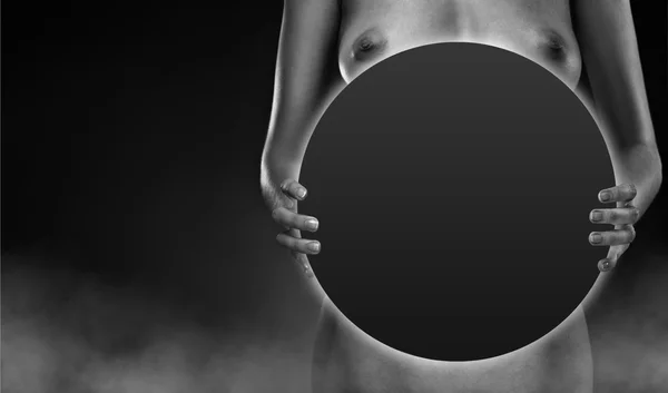 stock image Seductive naked woman holding glow steel disk. Space for text