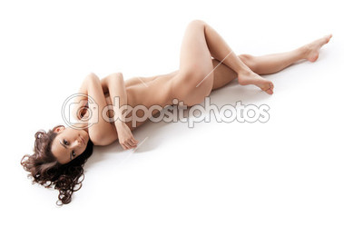 Perfect naked girl lay on white