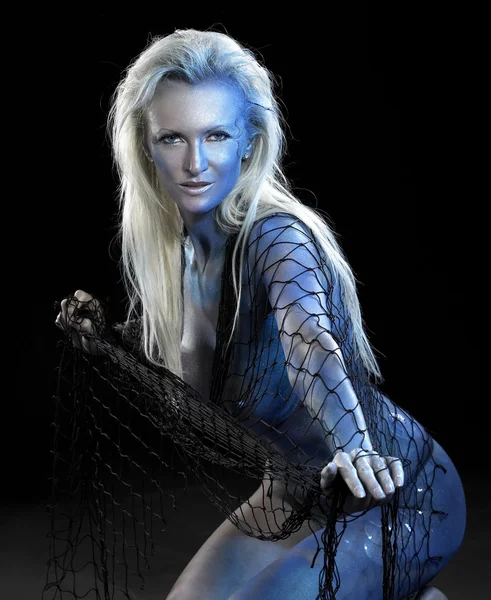 stock image Blue bodypainted woman and net